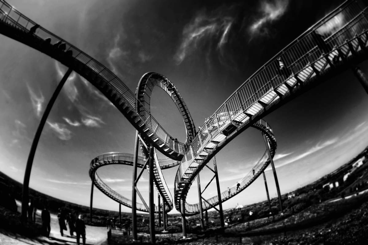 black-and-white grayscale photo of roller coaters roller coaster